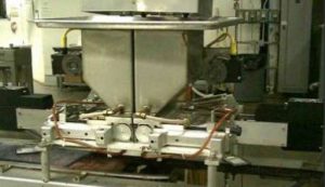 Chocolate  dispensing machine with two Exlar actuators